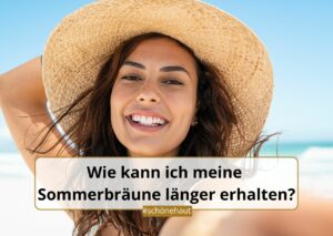 Lächelnde Frau mit Strohhut am Strand - Sommerbräune länger erhalten